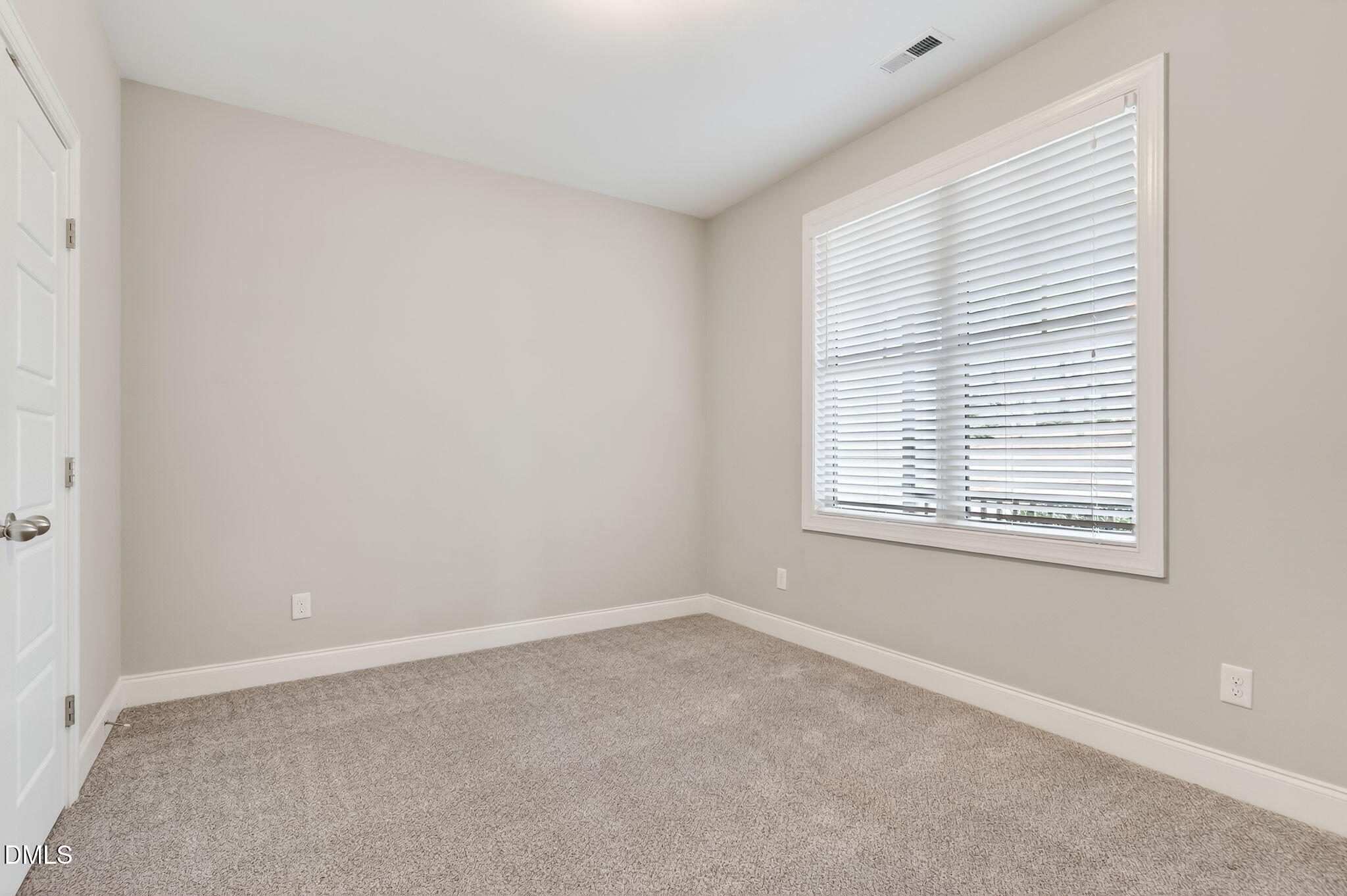5441 Fantasy Moth Drive Garner, NC 27529 - Photo 24 of 55 an empty room with a window