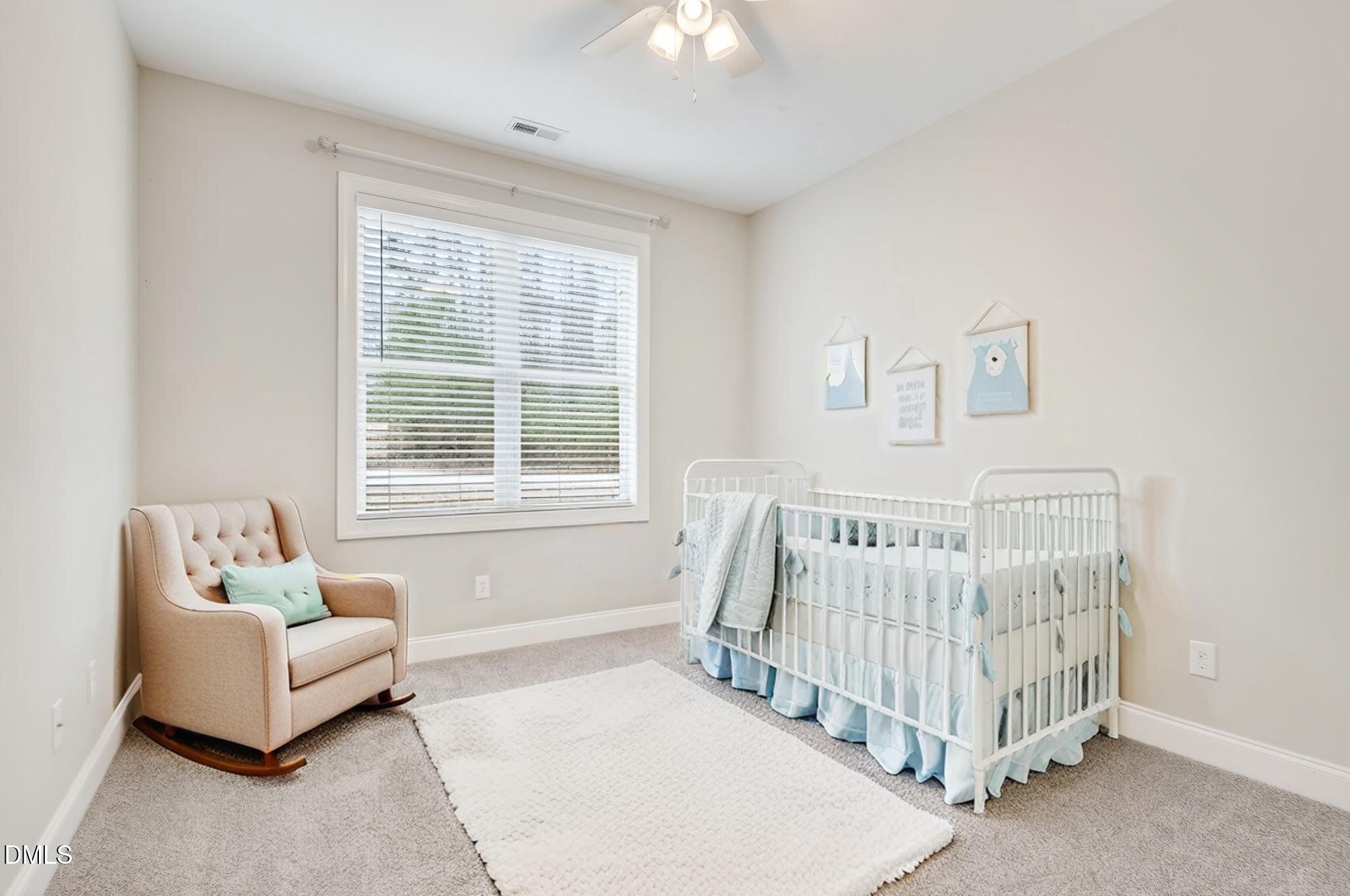 5441 Fantasy Moth Drive Garner, NC 27529 - Photo 27 of 55 a bedroom with a bed and a white couch