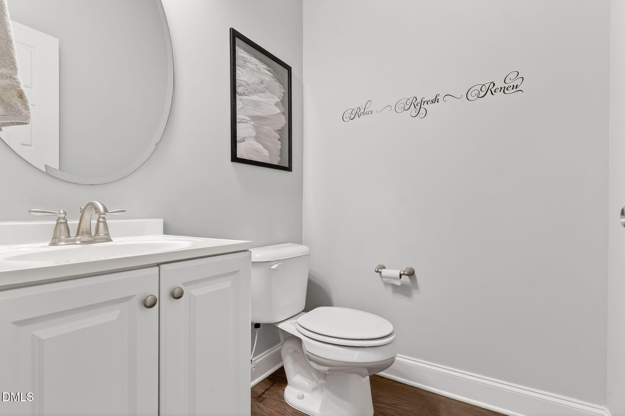 5441 Fantasy Moth Drive Garner, NC 27529 - Photo 32 of 55 a bathroom with a toilet a sink and mirror