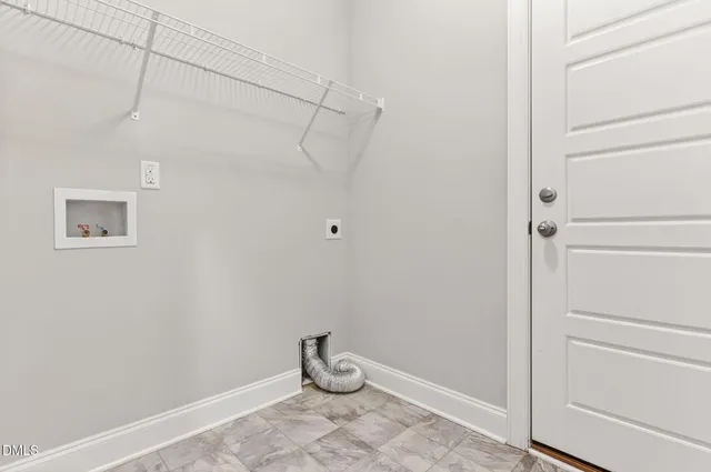 an empty room with a empty space and windows