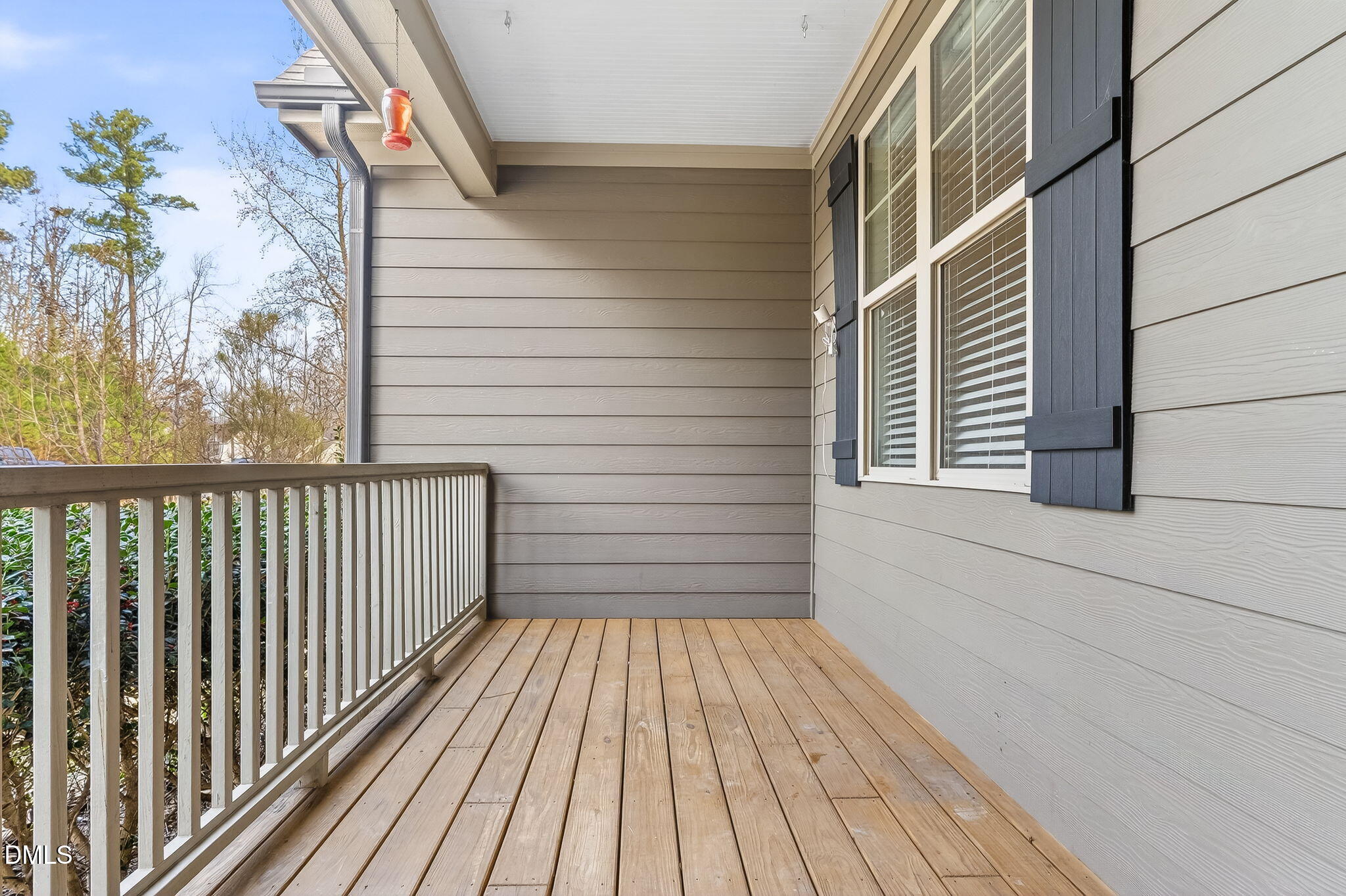 5441 Fantasy Moth Drive Garner, NC 27529 - Photo 4 of 55 a view of a balcony with wooden floor