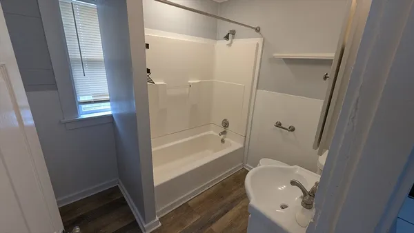 a bathroom with a shower and a toilet