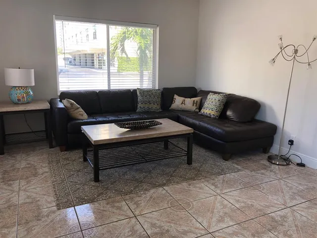 a living room with furniture and a window