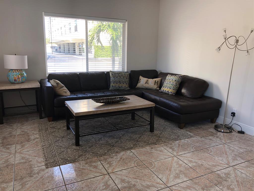 2928 North Ocean Boulevard, Unit 3 Fort Lauderdale, FL 33308 - Photo 3 of 5 a living room with furniture and a window