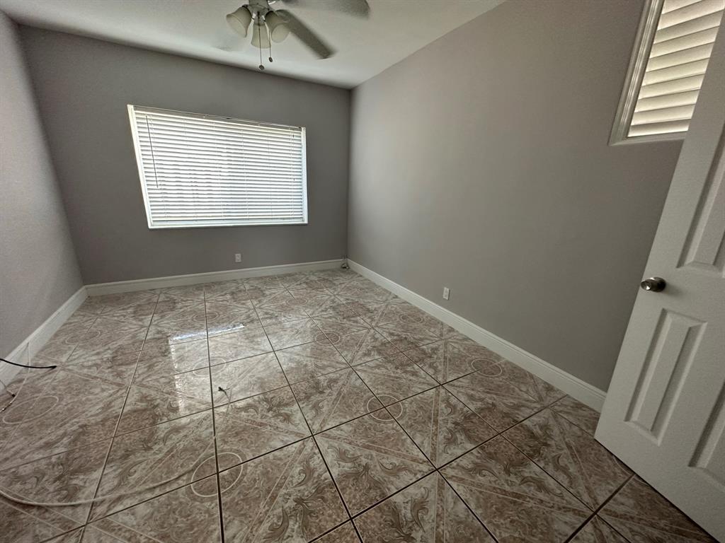 2928 North Ocean Boulevard, Unit 3 Fort Lauderdale, FL 33308 - Photo 5 of 5 a view of an empty room with a window