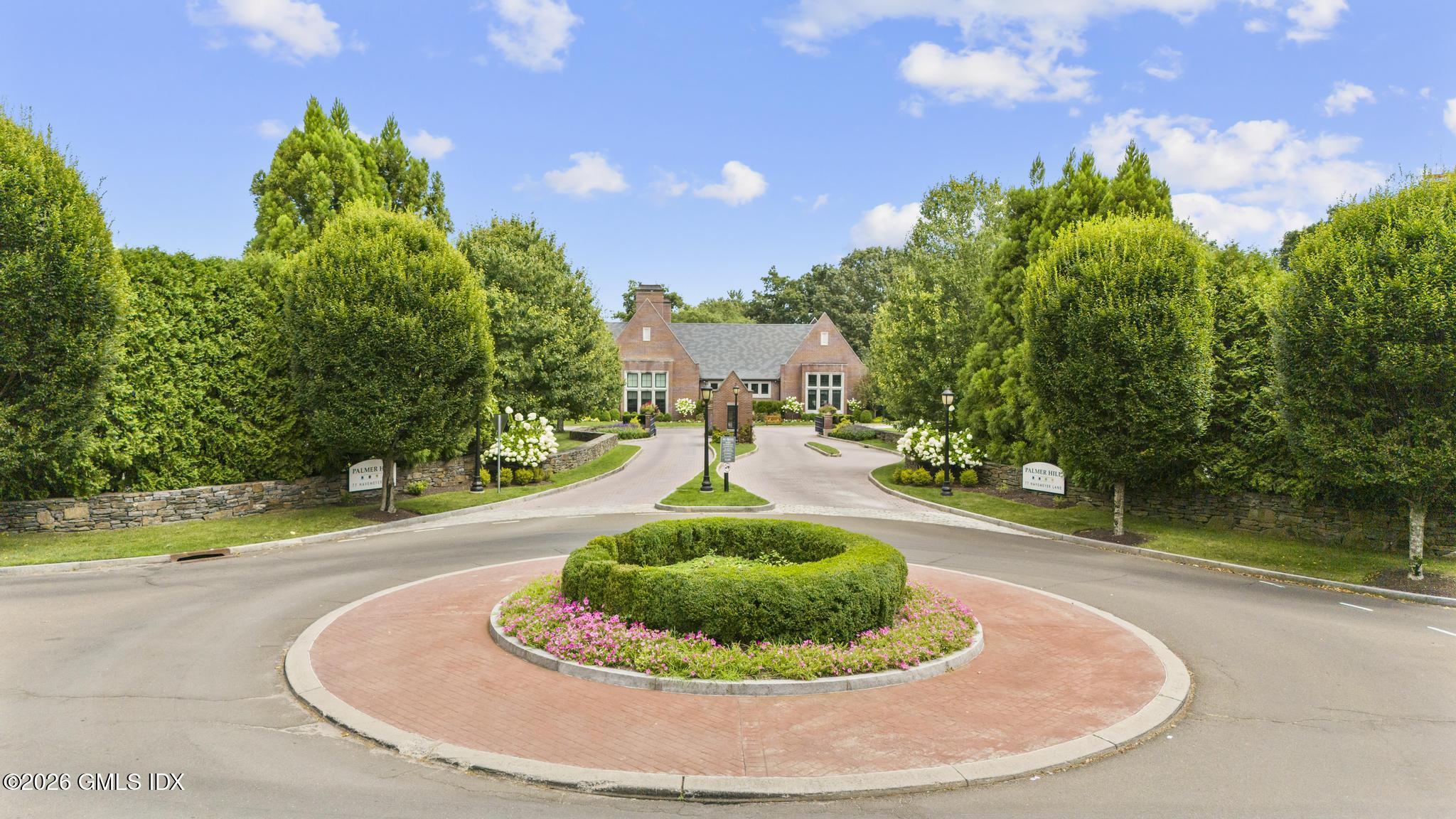 77 Havemeyer Lane, Unit 58 Stamford, CT 06902 - Photo 2 of 40 a view of a swimming pool with a yard