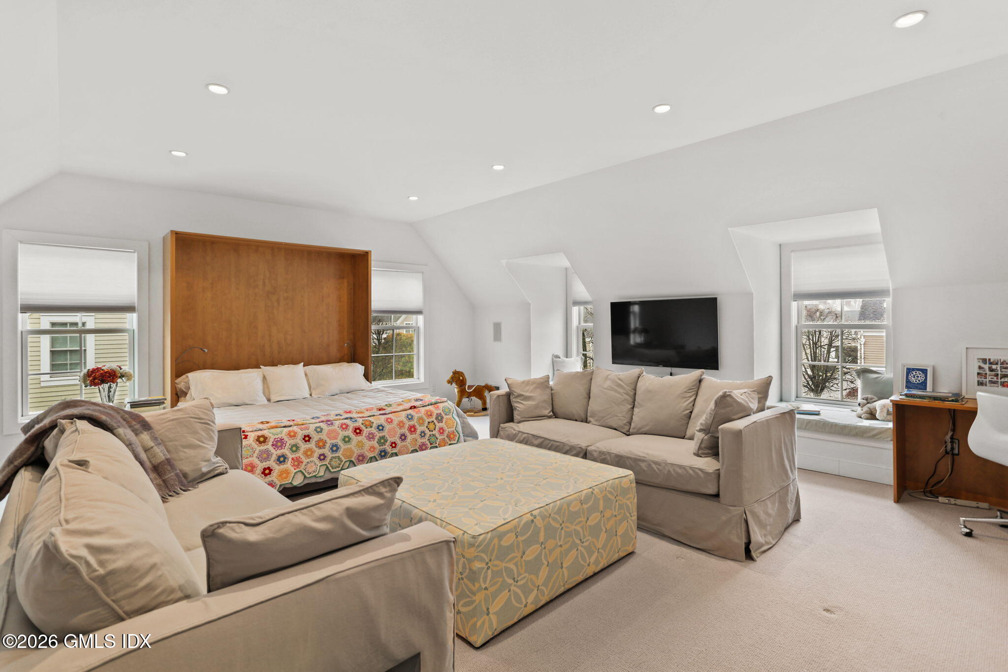 77 Havemeyer Lane, Unit 58 Stamford, CT 06902 - Photo 23 of 40 a living room with furniture and a flat screen tv