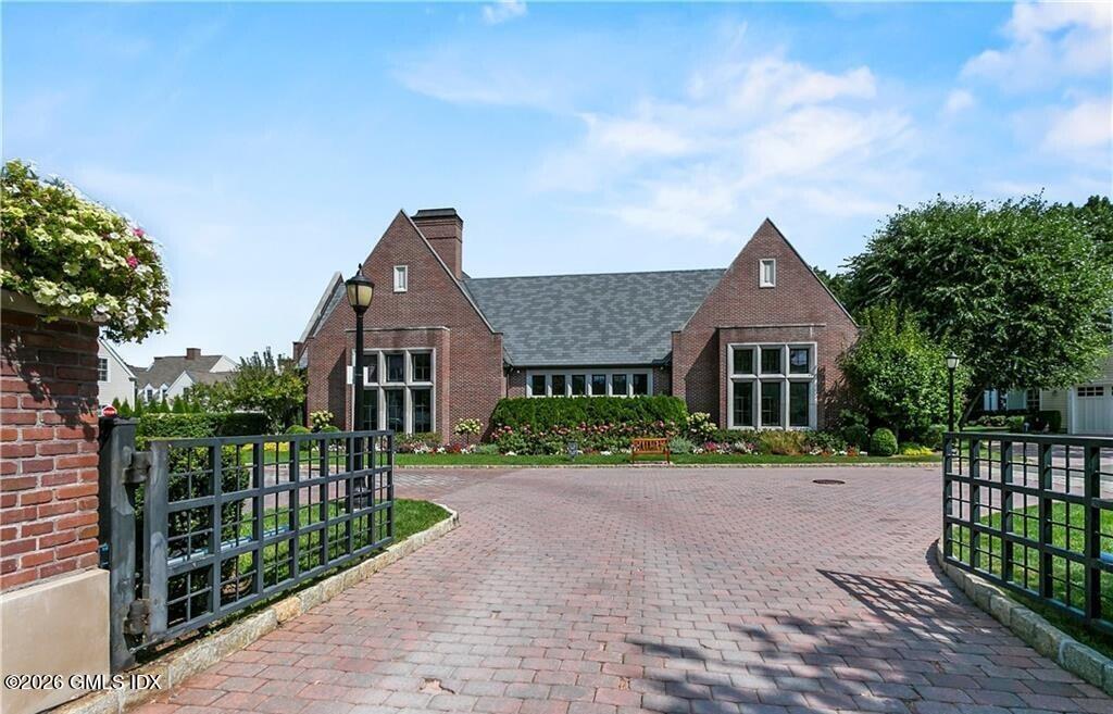 77 Havemeyer Lane, Unit 58 Stamford, CT 06902 - Photo 31 of 40 a front view of a house with a yard