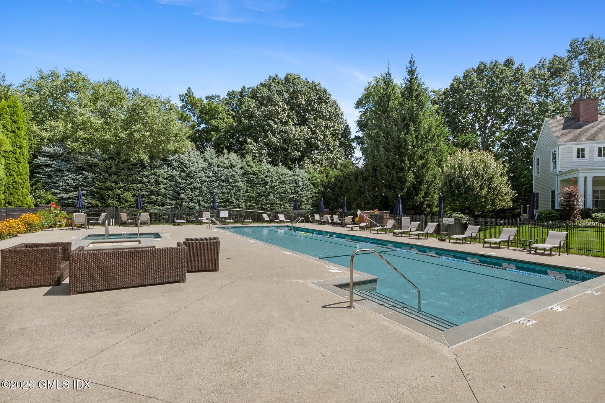 77 Havemeyer Lane, Unit 58 Stamford, CT 06902 - Photo 33 of 40 a view of swimming pool with chairs