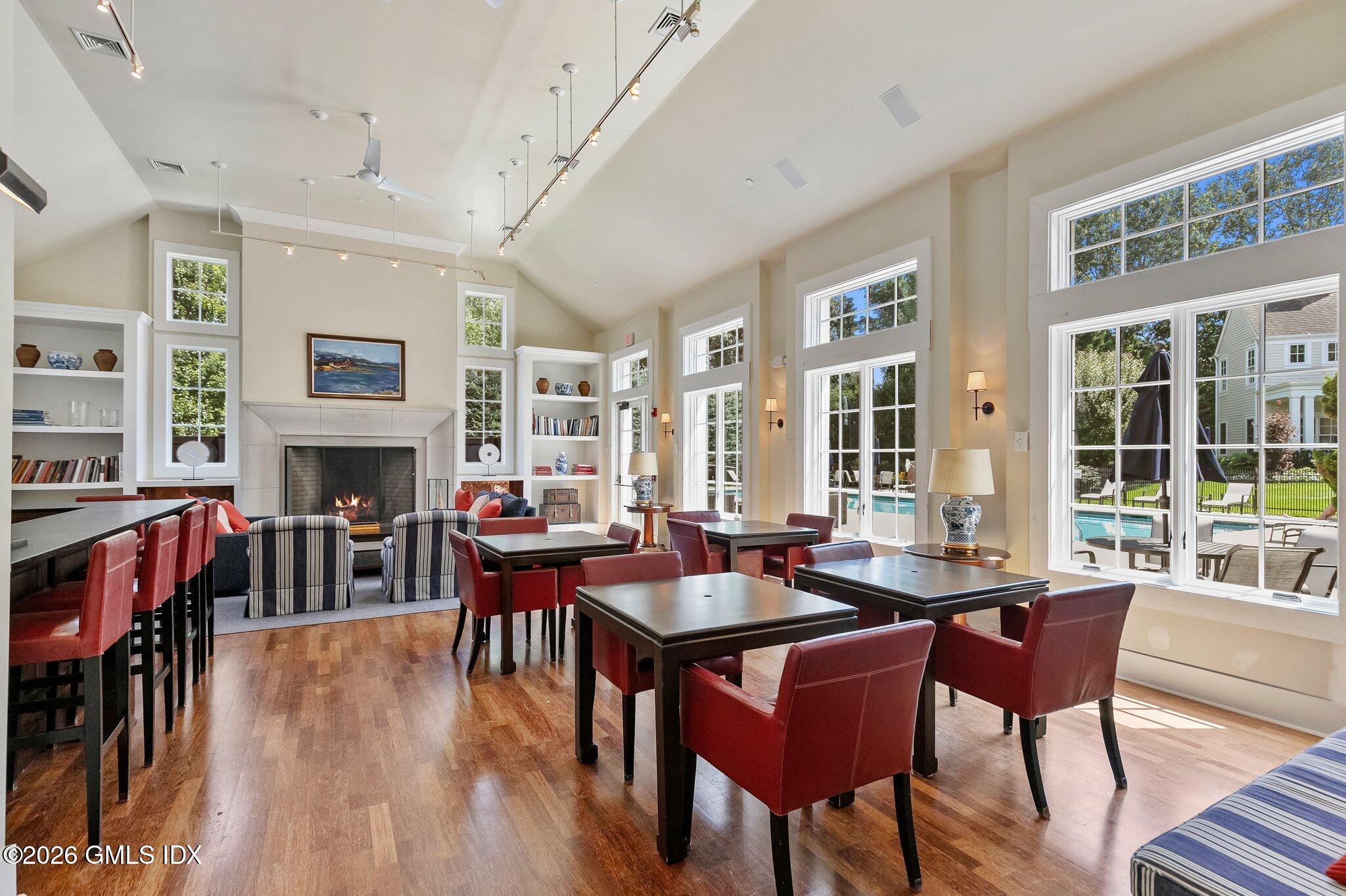 77 Havemeyer Lane, Unit 58 Stamford, CT 06902 - Photo 35 of 40 a dining room with furniture window and wooden floor
