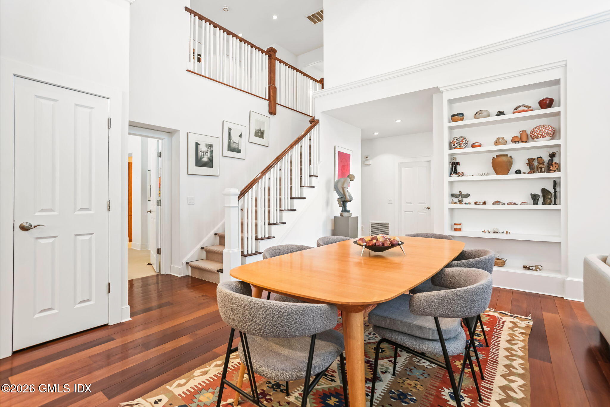 77 Havemeyer Lane, Unit 58 Stamford, CT 06902 - Photo 6 of 40 a dining room with furniture and wooden floor