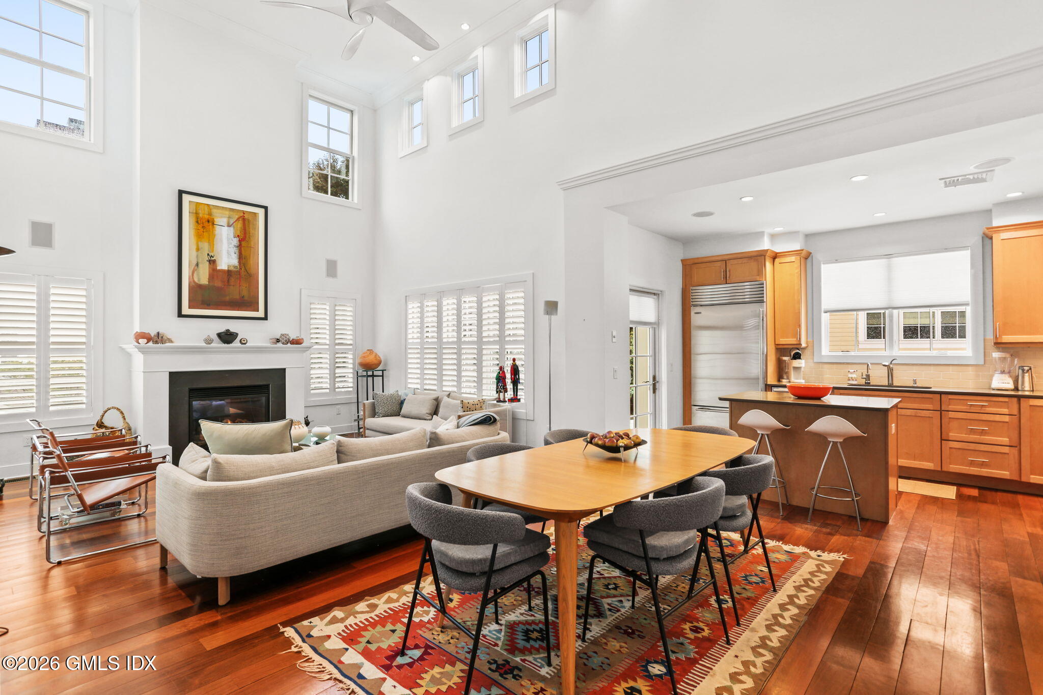 77 Havemeyer Lane, Unit 58 Stamford, CT 06902 - Photo 7 of 40 a living room with fireplace furniture and a large window