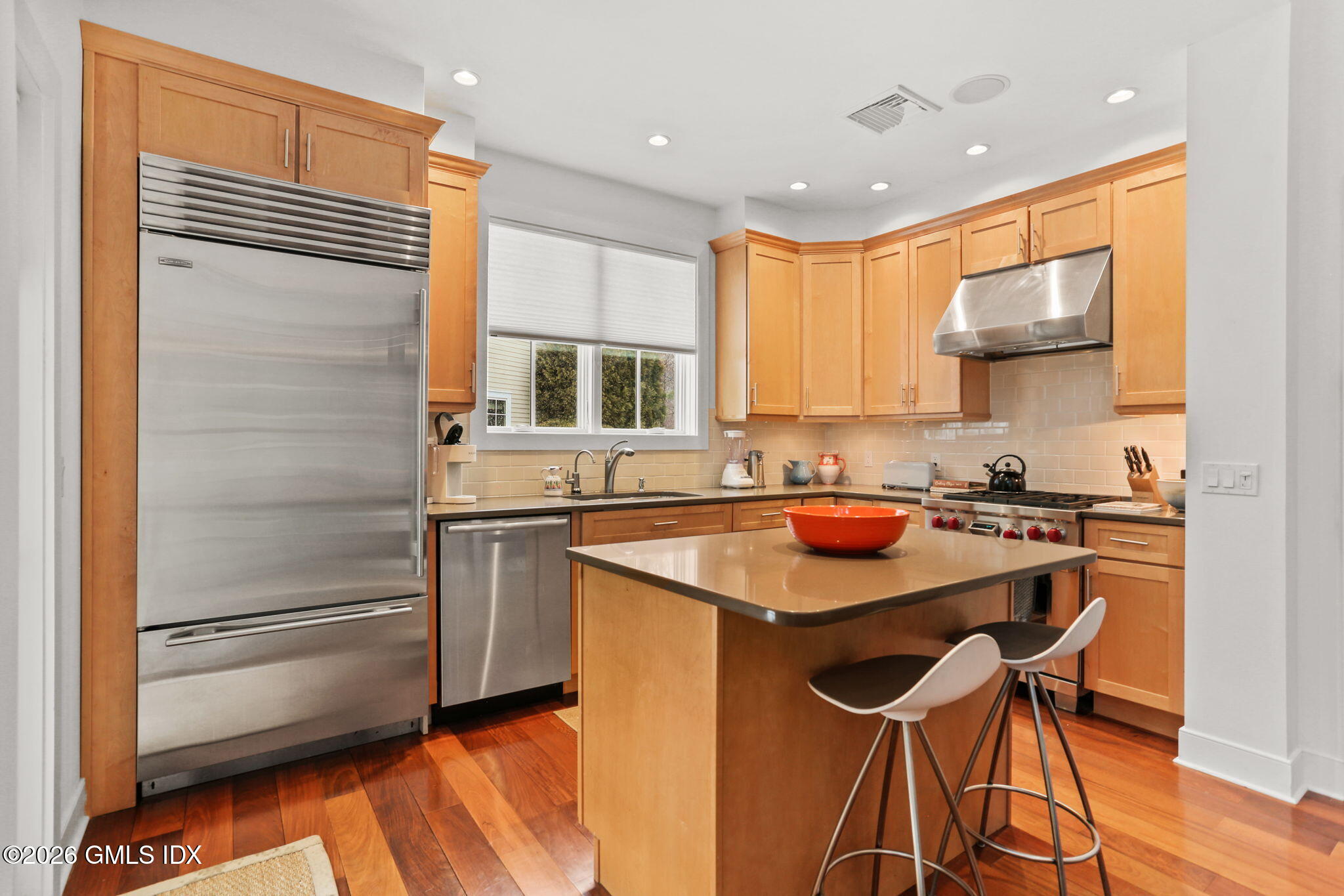 77 Havemeyer Lane, Unit 58 Stamford, CT 06902 - Photo 8 of 40 a kitchen with stainless steel appliances granite countertop a sink stove and refrigerator