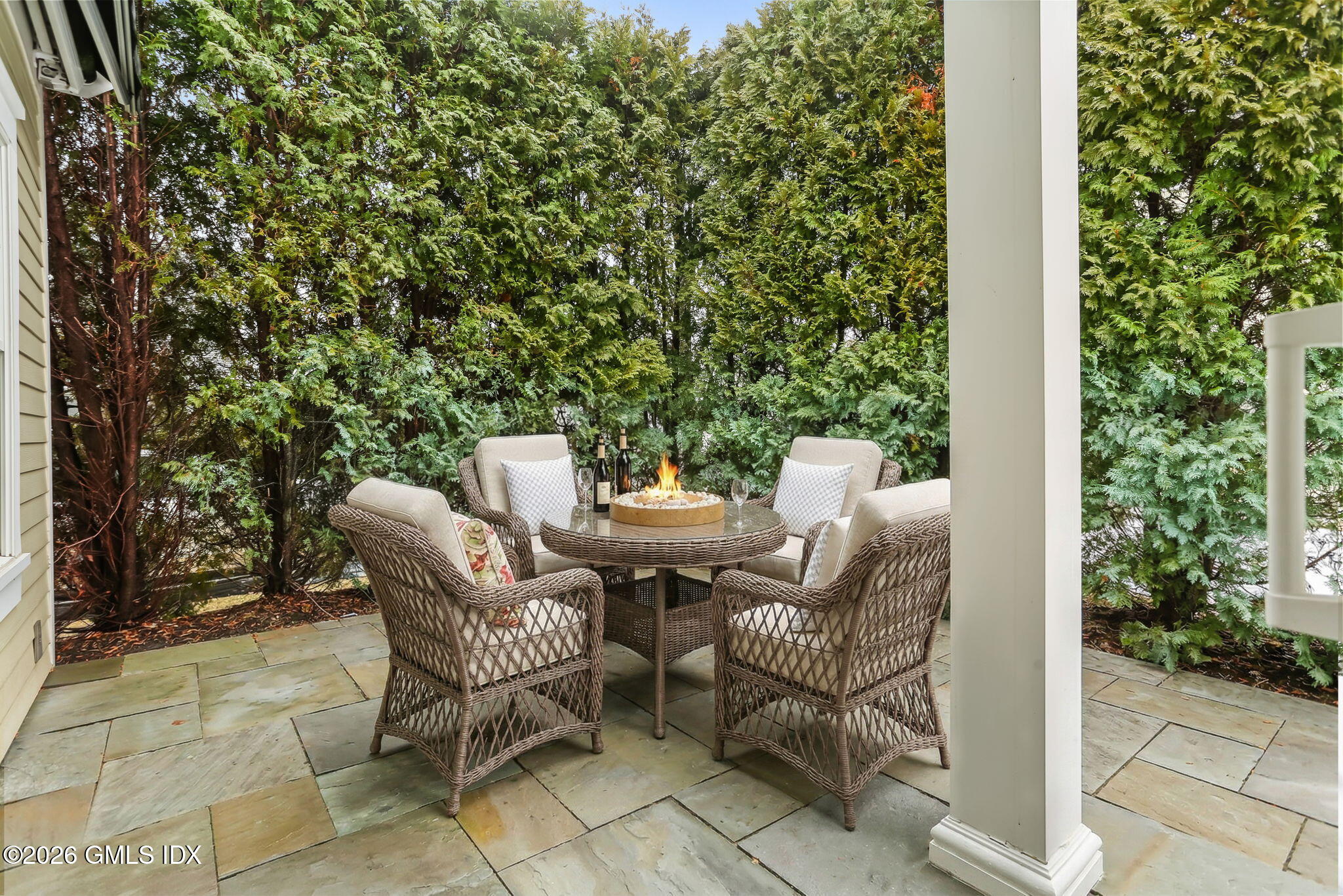 77 Havemeyer Lane, Unit 58 Stamford, CT 06902 - Photo 9 of 40 a view of a patio with a couple of chairs