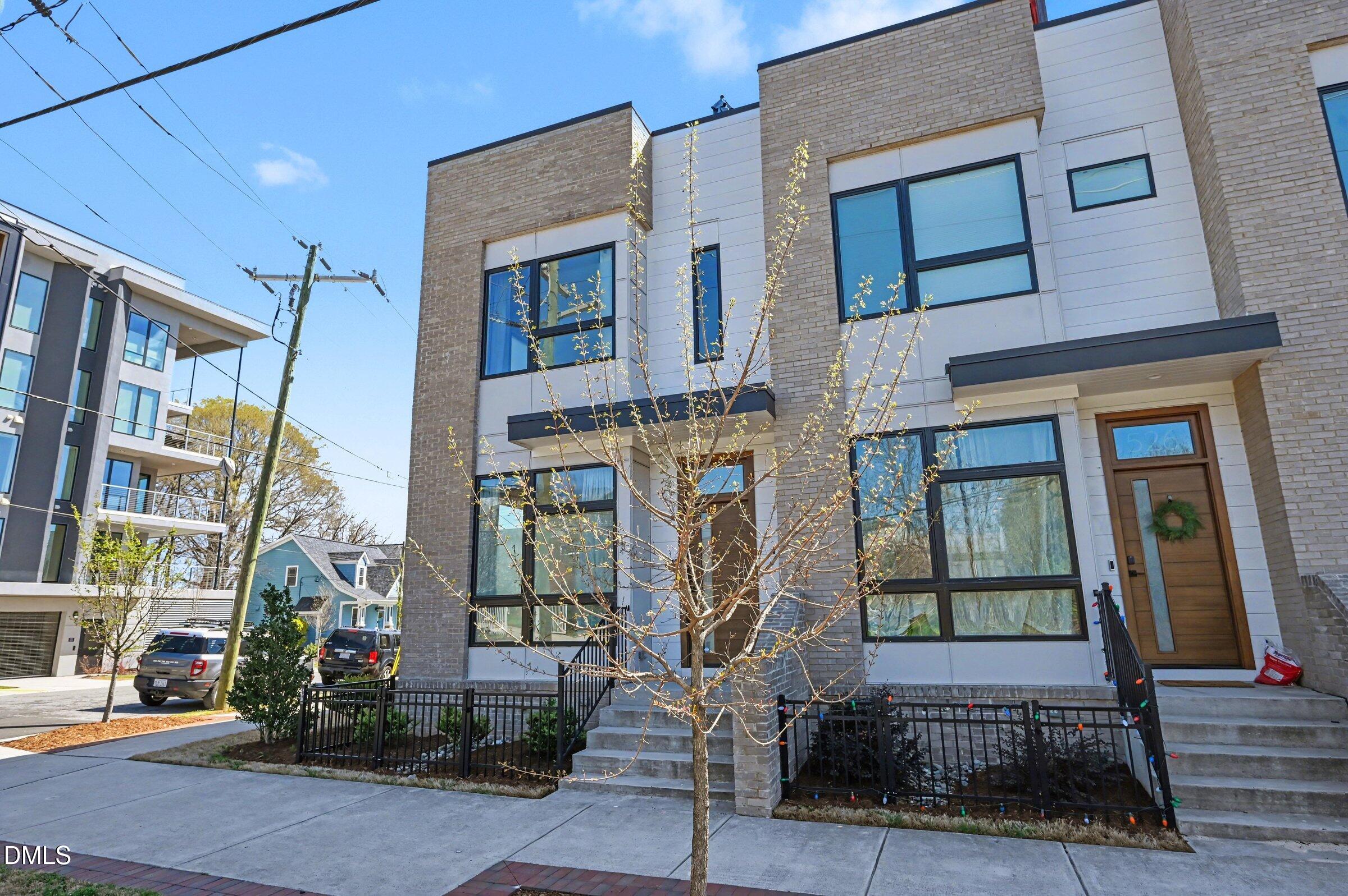 528 North Roxboro Street Durham, NC 27701 - Photo 2 of 26 a front view of a building with large windows