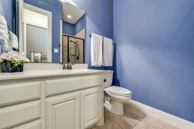 a bedroom with two beds and window