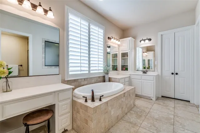 a bed room with a bed and a chair