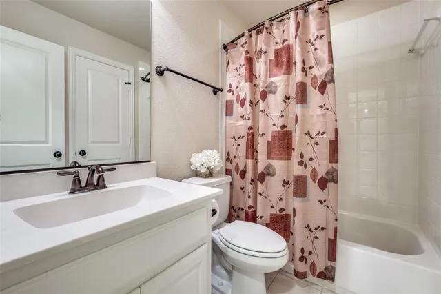 a bedroom with a bed chair and a window