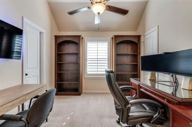a kitchen with a stove and a white wooden cabinets