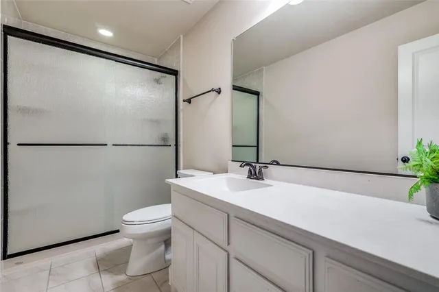 a living room with furniture and a projector screen