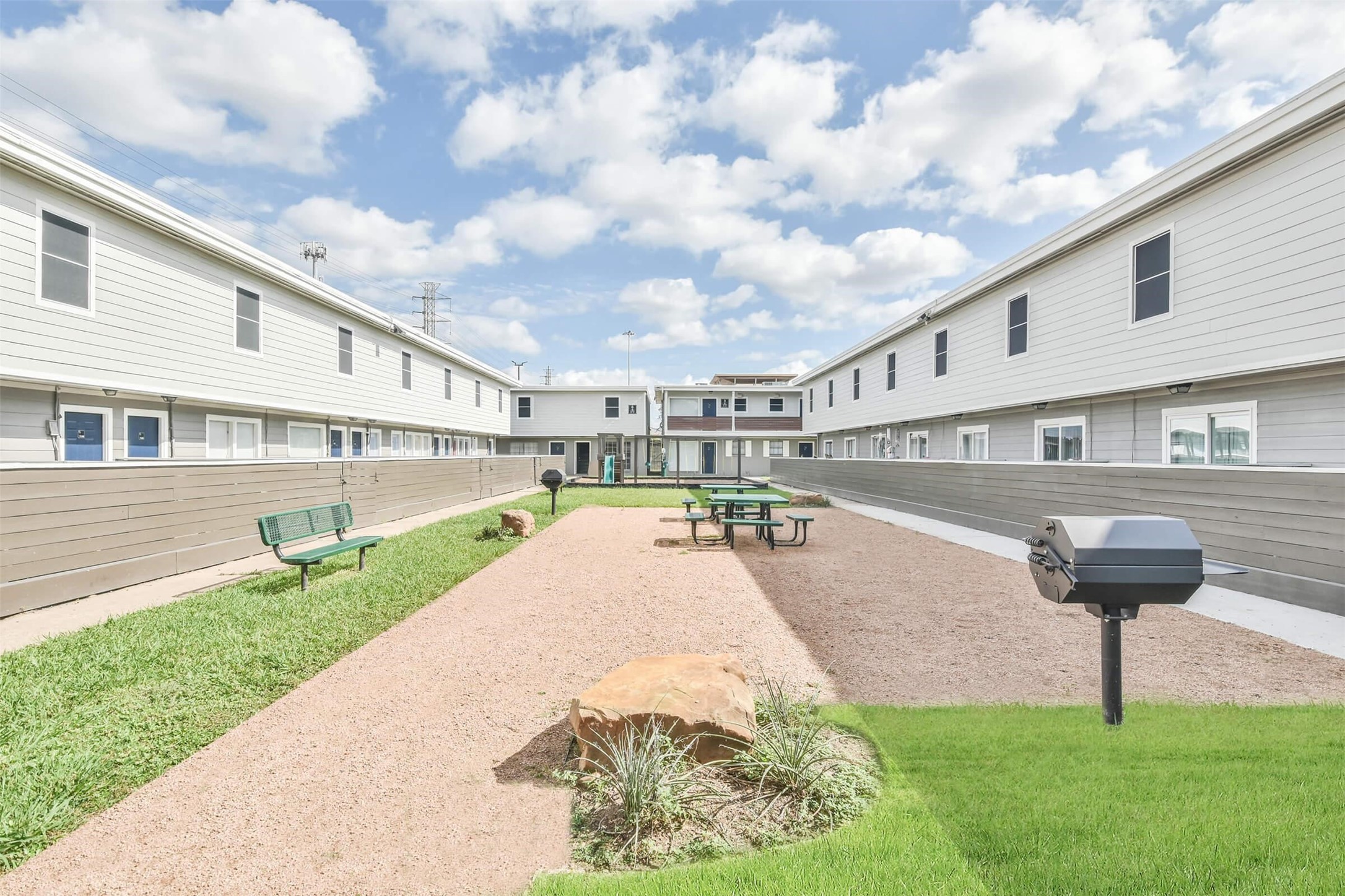8271 Stone Street, Unit 7512 Houston, TX 77061 - Photo 16 of 21 a swimming pool with outdoor seating and yard