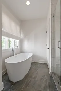 a white bath tub sitting in a bathroom
