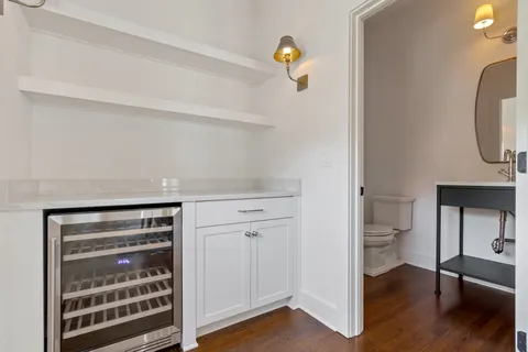 a view of bathroom with a toilet a sink and a window
