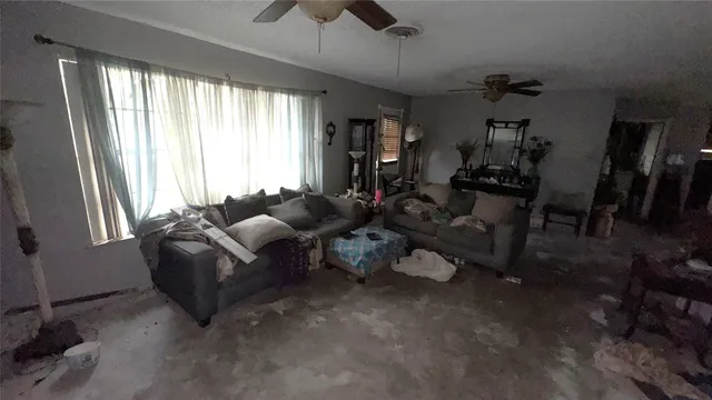 a living room with furniture and a window