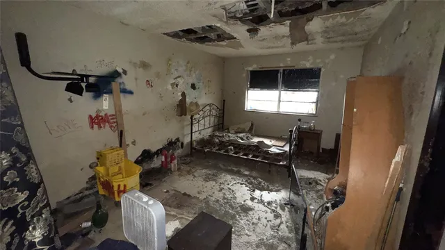 a room with gym equipment and a window