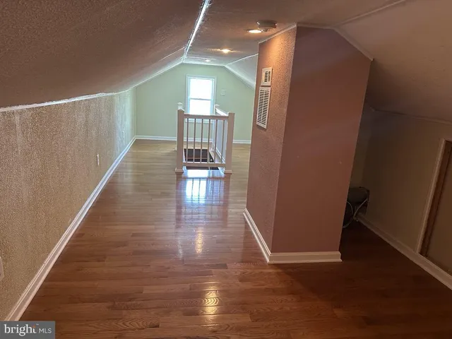 a view of gallery with wooden floor