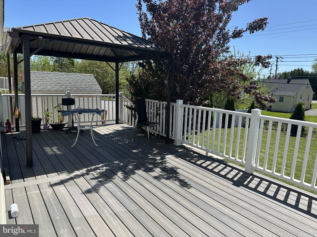 308 Pinewood Road Baltimore, MD 21222 - Photo 19 of 21 a view of a wooden deck with a bench