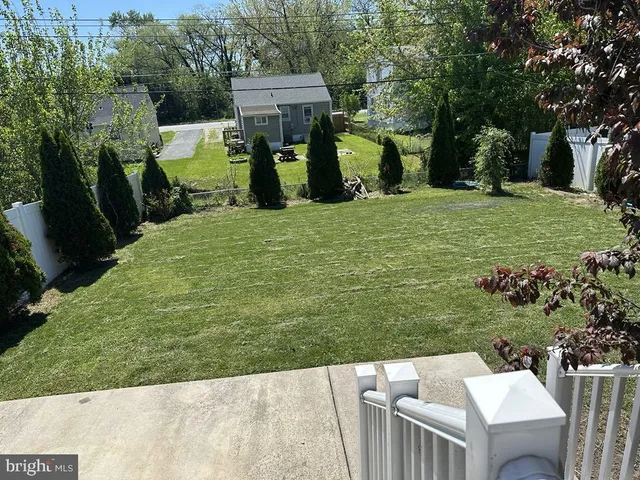 a view of a backyard with sitting area