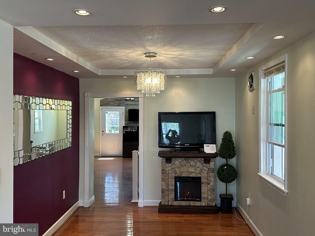 308 Pinewood Road Baltimore, MD 21222 - Photo 6 of 21 a living room with furniture and a fireplace