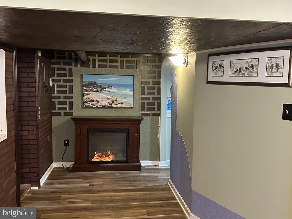 308 Pinewood Road Baltimore, MD 21222 - Photo 9 of 21 a living room with furniture and a fireplace