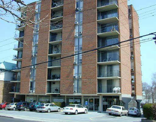 87 Glenbrook Road, Unit 7D Stamford, CT 06902 - Photo 1 of 1 a car parked in front of a building