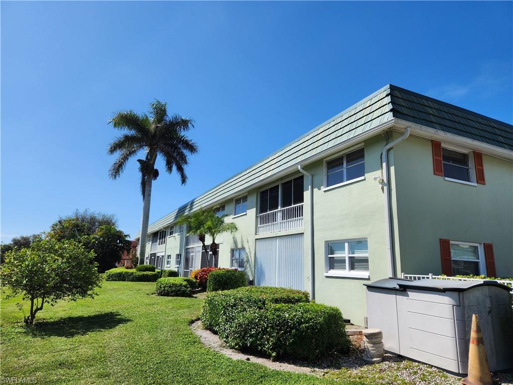 300 Valley Stream Drive, Unit D5 Naples, FL 34113 - Photo 10 of 12 a house view with a garden space