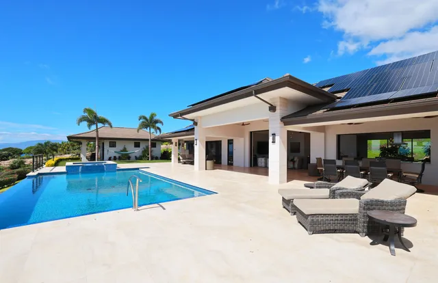 a view of a patio with swimming pool table and chairs