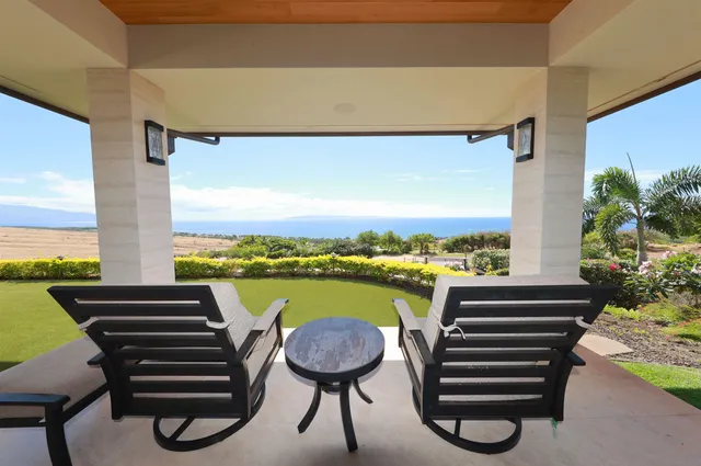 a view of a balcony with lake view and a floor to ceiling window