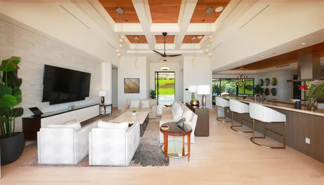 a living room with fireplace furniture and a flat screen tv