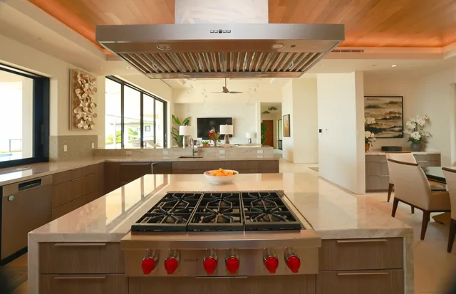 a kitchen with a stove a sink and a refrigerator