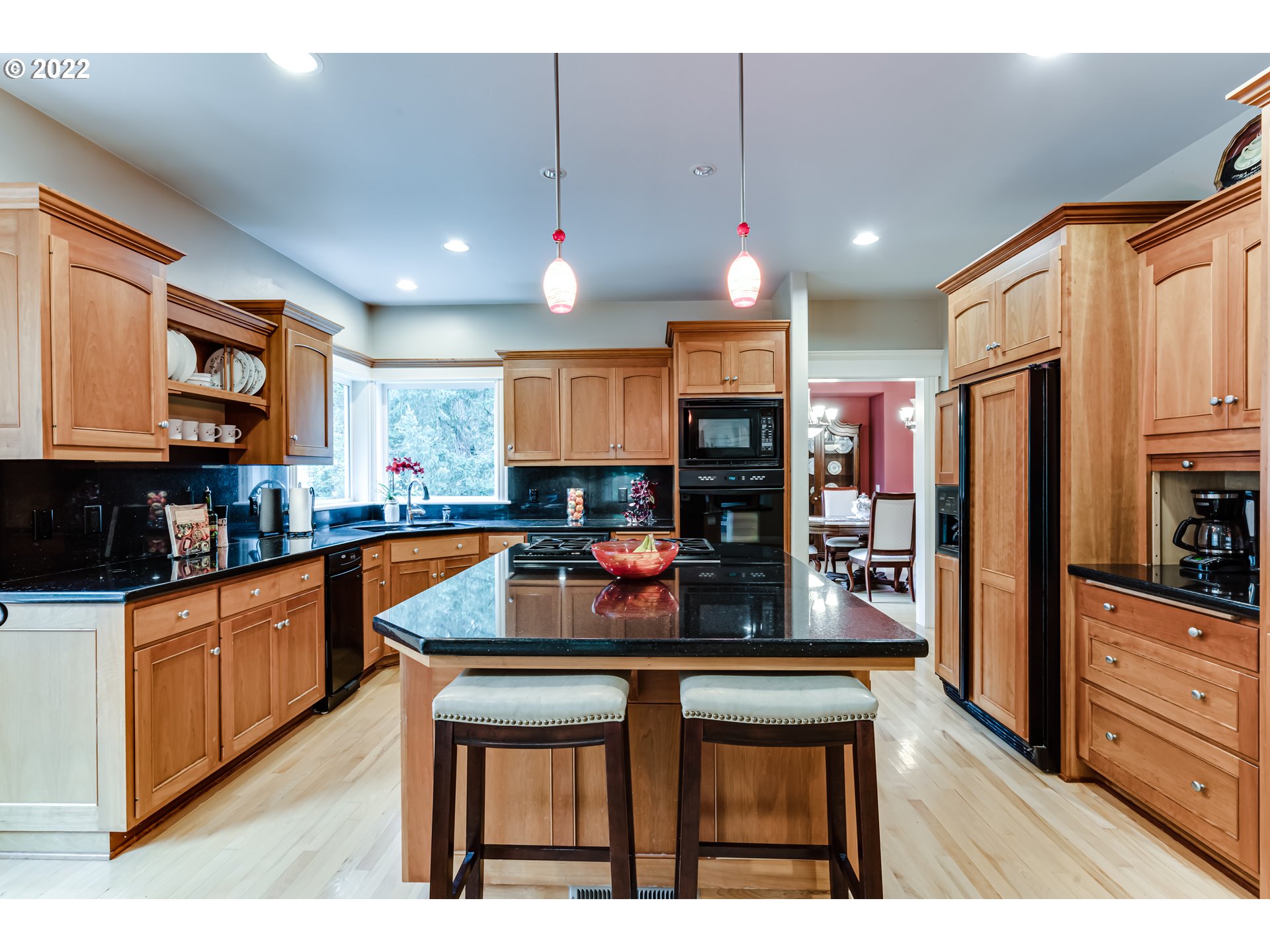85281 Silver Crest Drive Eugene, OR 97405 - Photo 14 of 32 a kitchen with stainless steel appliances kitchen island granite countertop a refrigerator a stove top oven and a sink