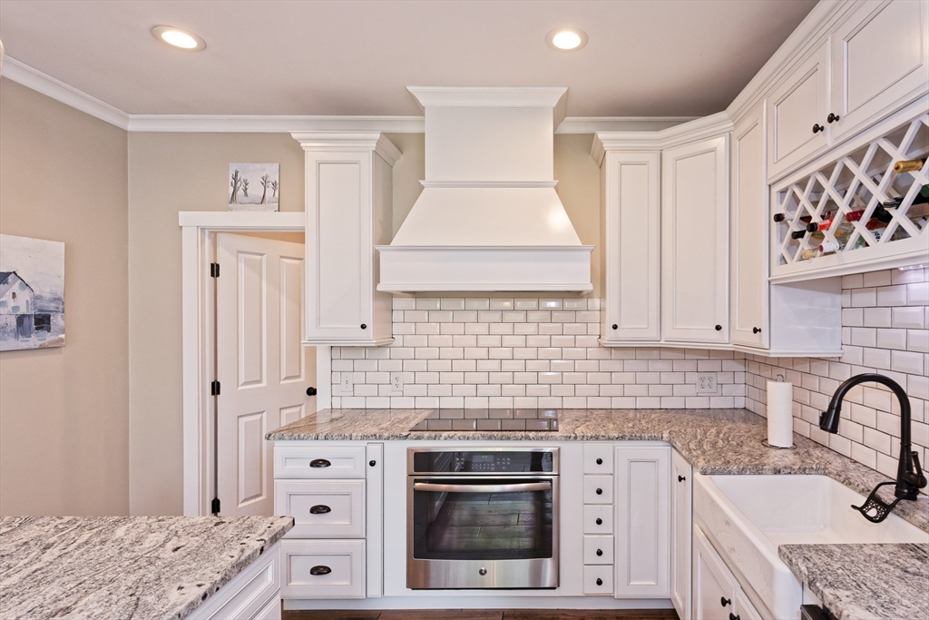 146 7 Bridge Road Lancaster, MA 01523 - Photo 12 of 42 a kitchen with stainless steel appliances granite countertop a stove a sink and a refrigerator