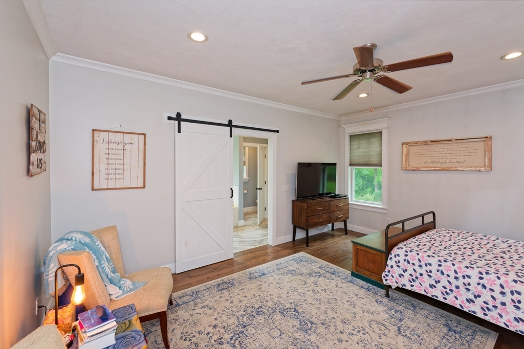 146 7 Bridge Road Lancaster, MA 01523 - Photo 17 of 42 a living room with furniture and a flat screen tv