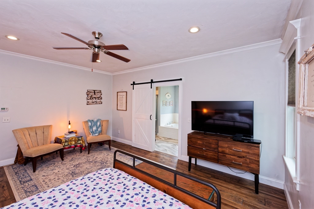146 7 Bridge Road Lancaster, MA 01523 - Photo 18 of 42 a living room with furniture and a flat screen tv