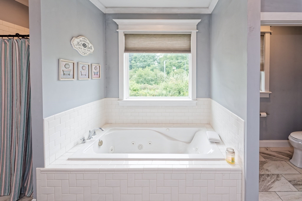 146 7 Bridge Road Lancaster, MA 01523 - Photo 20 of 42 a white bath tub sitting next to a toilet