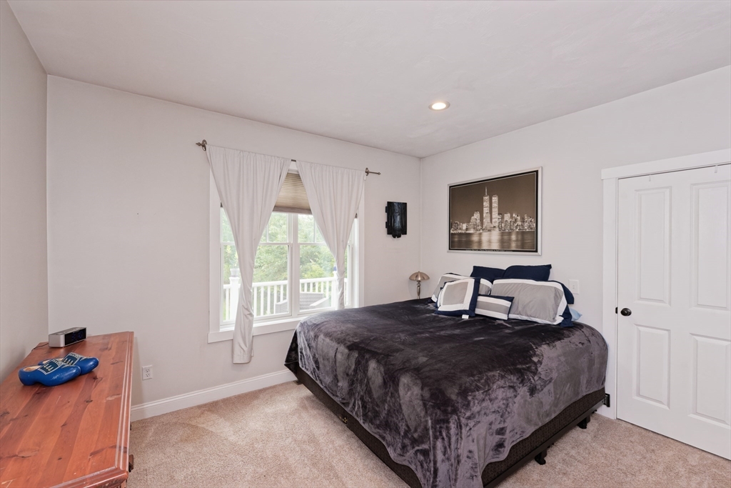 146 7 Bridge Road Lancaster, MA 01523 - Photo 21 of 42 a bedroom with a bed and a window