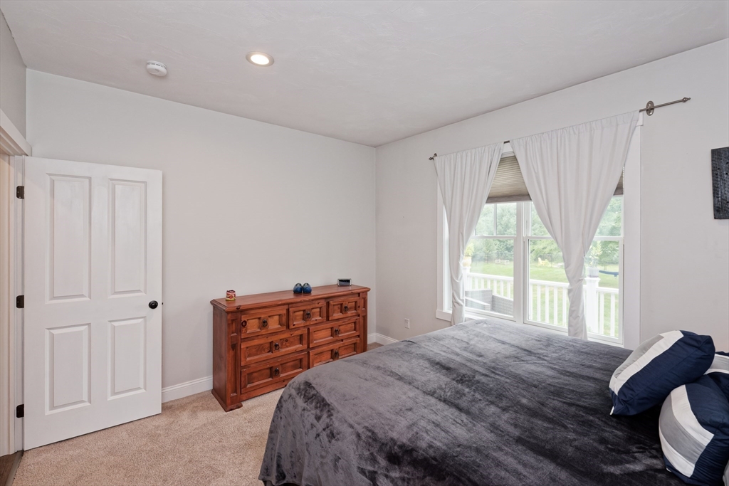 146 7 Bridge Road Lancaster, MA 01523 - Photo 22 of 42 a bedroom with a bed and a window