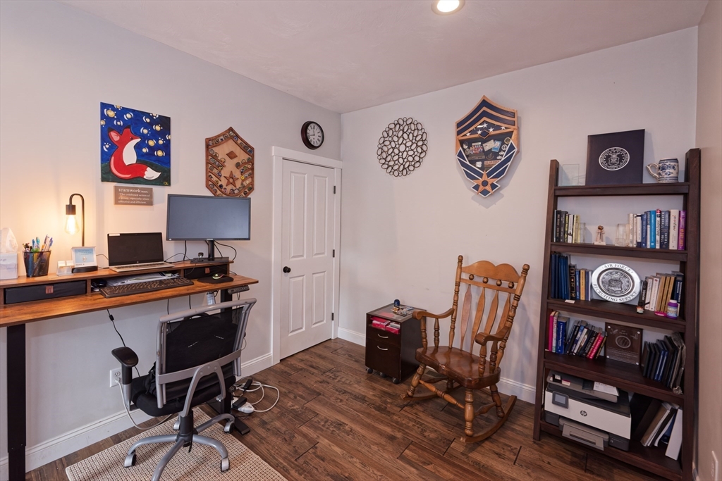 146 7 Bridge Road Lancaster, MA 01523 - Photo 24 of 42 a view of a workspace with furniture and wooden floor