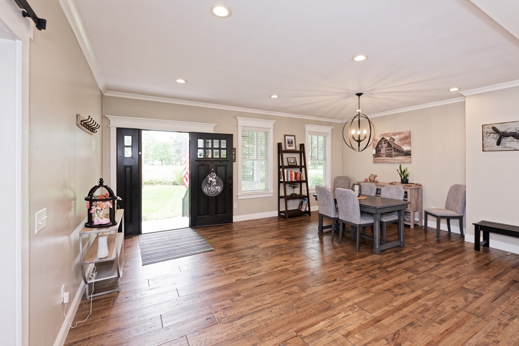 146 7 Bridge Road Lancaster, MA 01523 - Photo 3 of 42 a view of a dining room with furniture and wooden floor