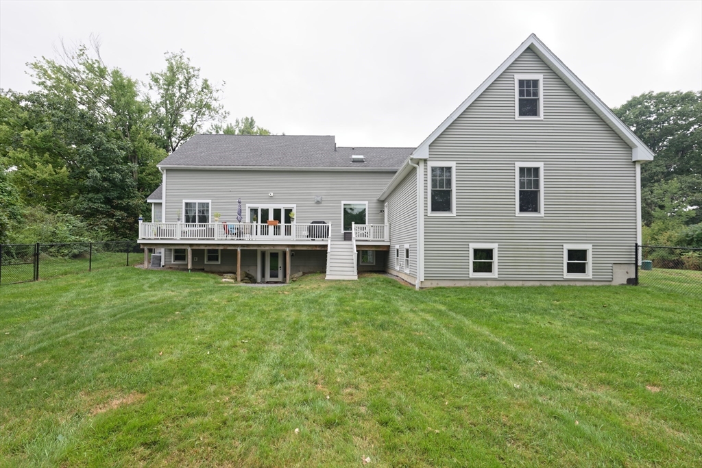 146 7 Bridge Road Lancaster, MA 01523 - Photo 37 of 42 a view of a house with a yard